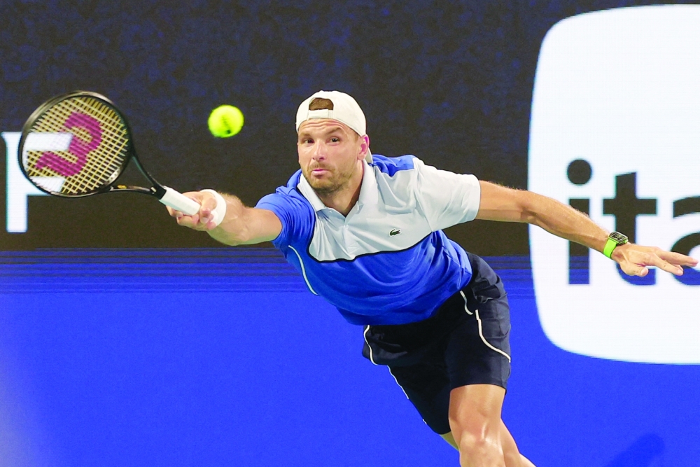 Mar 28, 2024; Miami Gardens, FL, USA; Grigor Dmitrov (BUL) reaches for a forehand against against Carlos Alcaraz (ESP) (not pictured) on day eleven of the Miami Open at Hard Rock Stadium. Mandatory Credit: Geoff Burke-USA TODAY Sports
