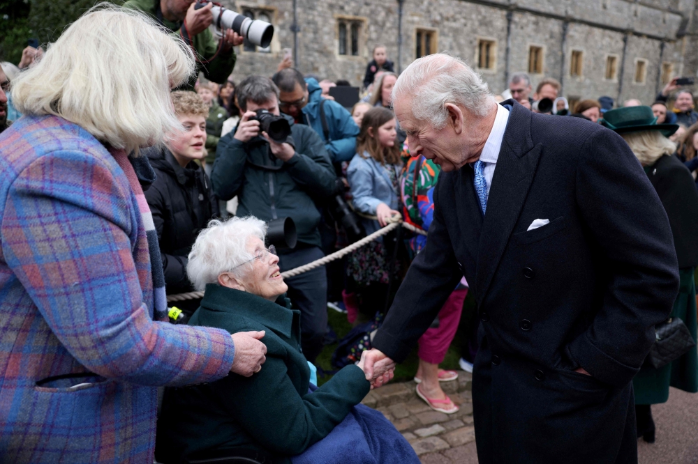 Britain's King Charles III greets well-wishers as they leave St. George's Chapel, in Windsor Castle. — AFP  