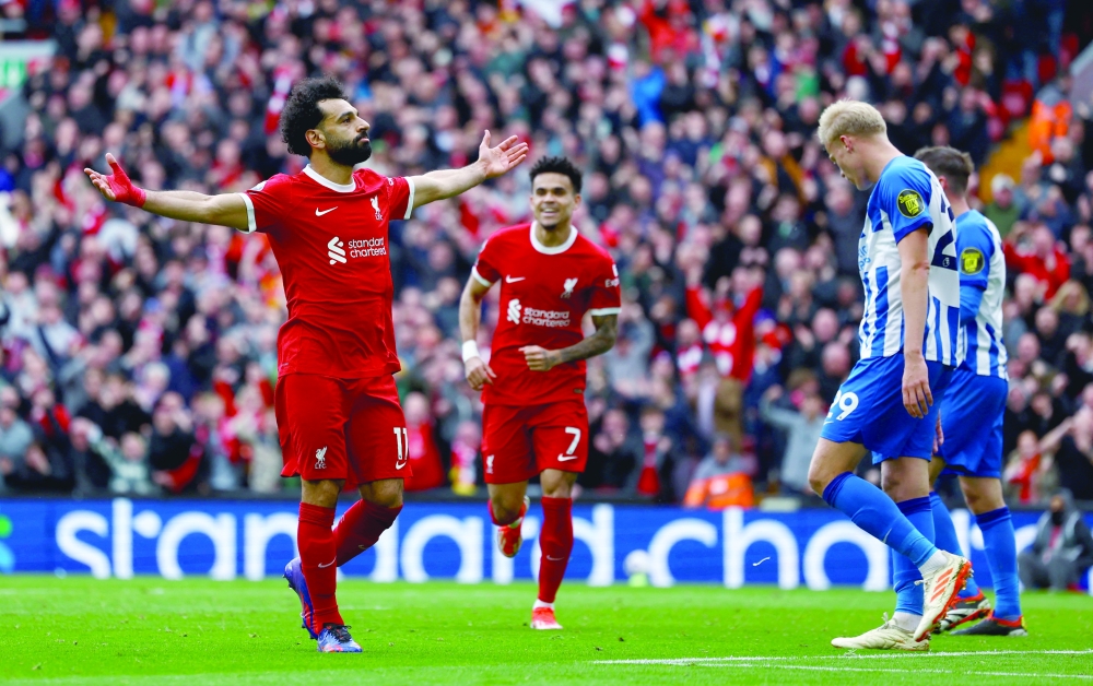 Mohamed Salah celebrates scoring their second goal.— REUTERS