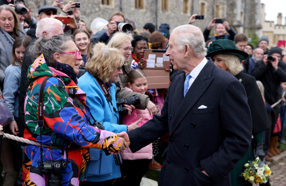 King Charles and Queen Camilla greet people after attending the Easter Matins Service at St. George's Chapel, Windsor Castle,