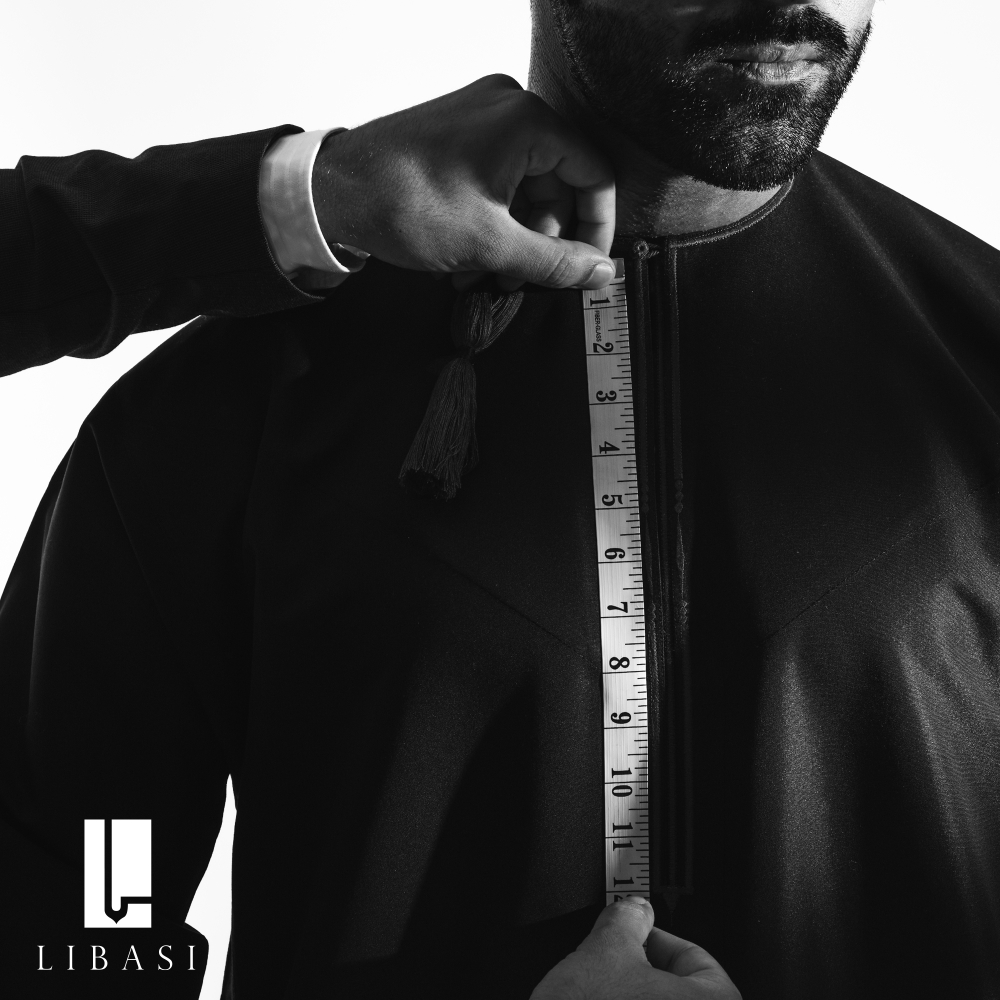Capture the essence of precision: A tailor takes measurements for the iconic Libasi dishdasha.
