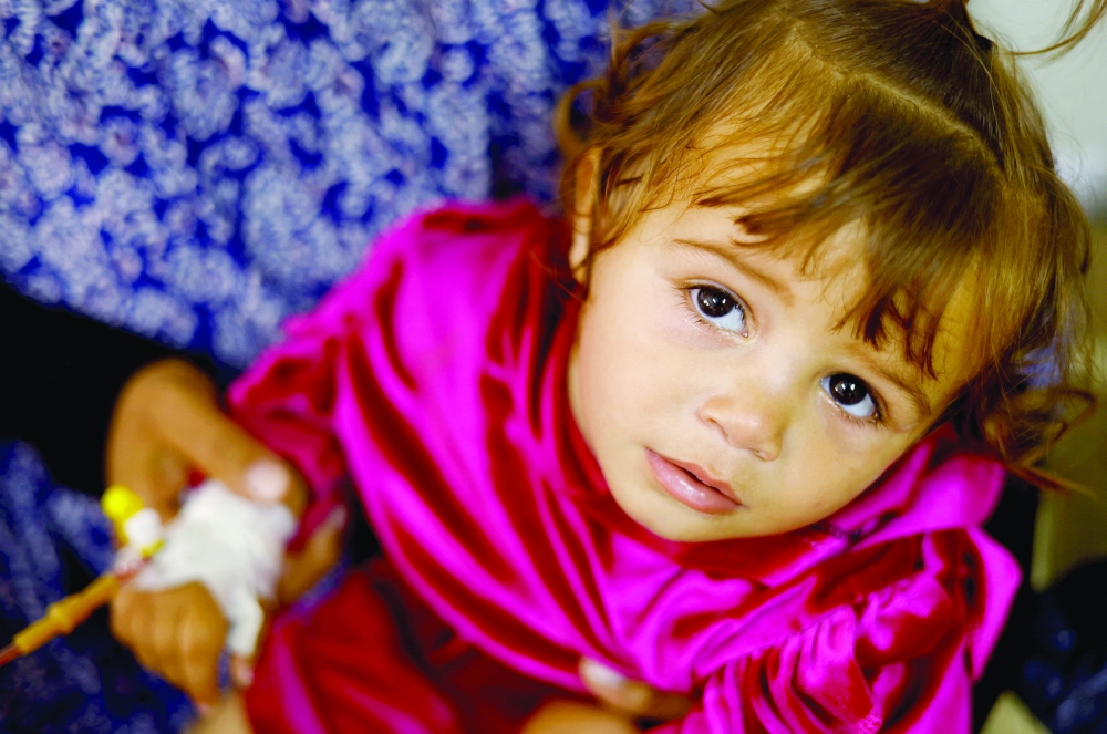 A Palestinian child suffering from malnutrition receives treatment at Al Awda health centre in Rafah on Monday. - Reuters