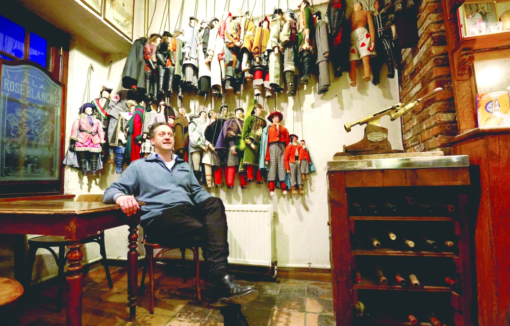 Nicolas Geal, Belgian puppetmaster and director of the Royal Toone Theatre, poses among puppets at the Toone Theatre in Brussels, Belgium, March 28, 2024. REUTERS/Yves Herman
