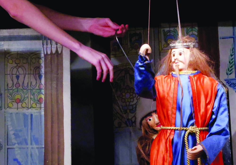 Guillaume Hoedt, Belgian puppetmaster at the Royal Toone Theatre, operates a puppet at the Toone Theatre in Brussels, Belgium, March 28, 2024.