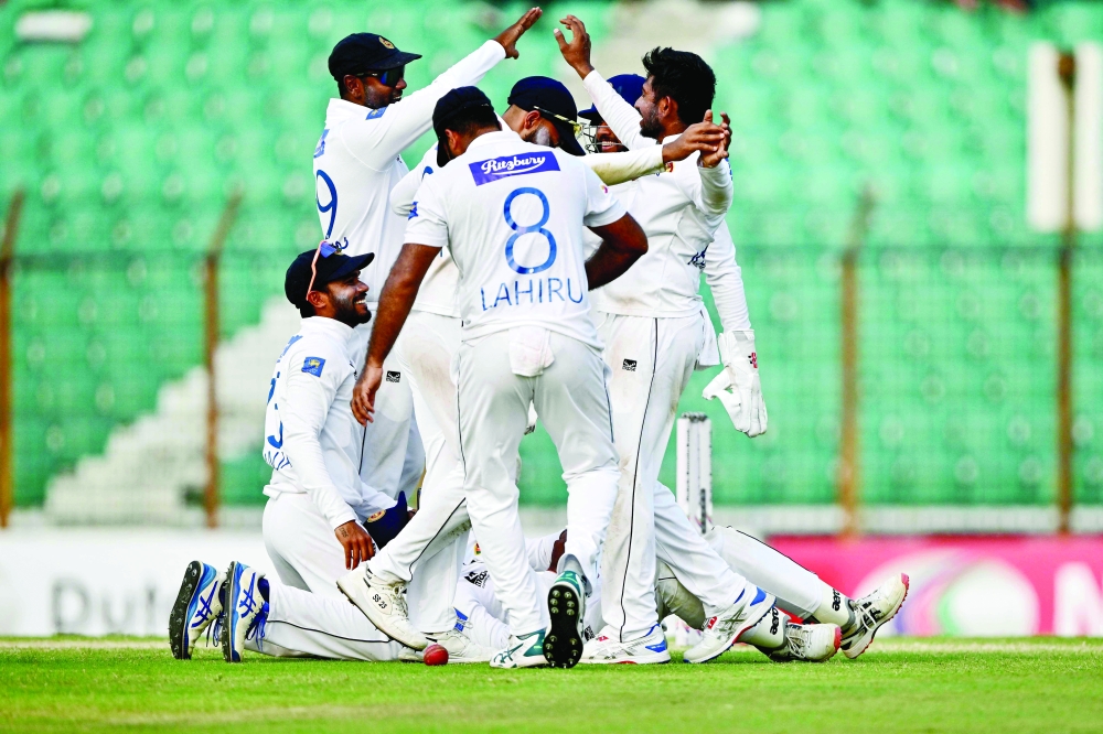 Sri Lanka's cricketers celebrate after the dismissal of Bangladesh痴 Shakib Al Hasan during the fourth day of the second Test cricket match between Bangladesh and Sri Lanka at the Zahur Ahmed Chowdhury Stadium in Chittagong on April 2, 2024.
