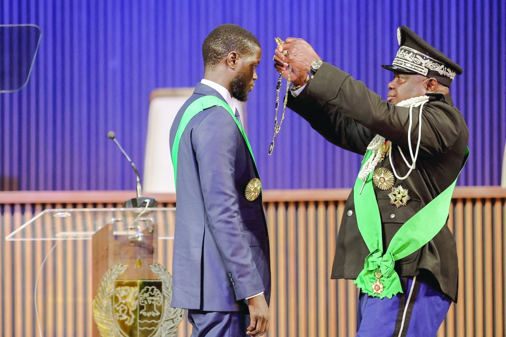 Bassirou Diomaye Faye (L) is sworn in as Senegal's President at an exhibition centre in the new town of Diamniadio near the capital Dakar. — AFP 