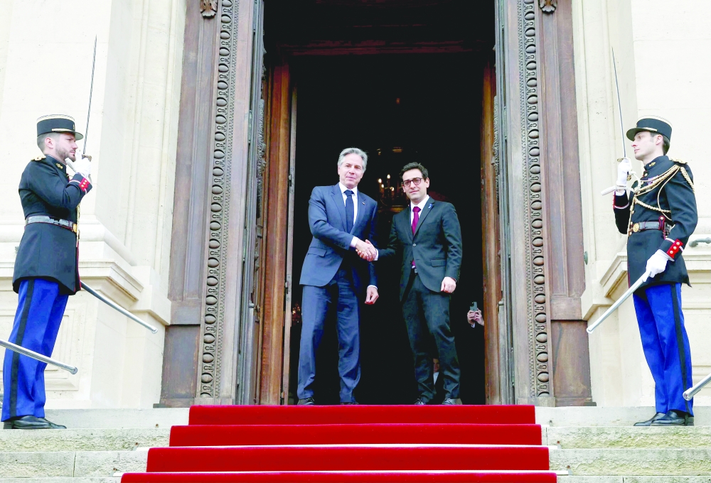 US Secretary of State Antony Blinken (L) shakes hands with French Foreign Minister Stephane Sejourne (R) prior to their meeting at the Ministry of Foreign Affairs in Paris. — AFP 