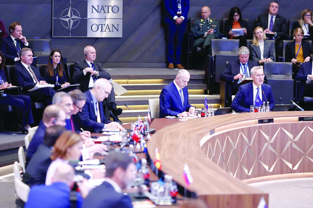 Nato Secretary-General Jens Stoltenberg (C) opens a round table during the North Atlantic Council (NAC) Ministers of Foreign Affairs, in Brussels. — AFP