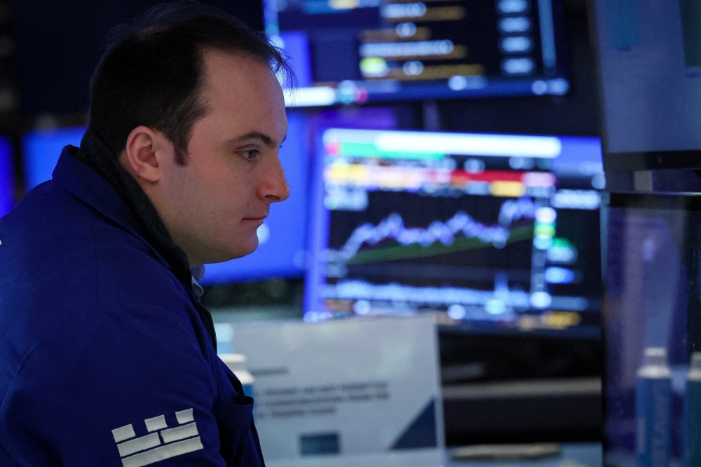 Traders work on the floor of the NYSE in New York-REUTERS