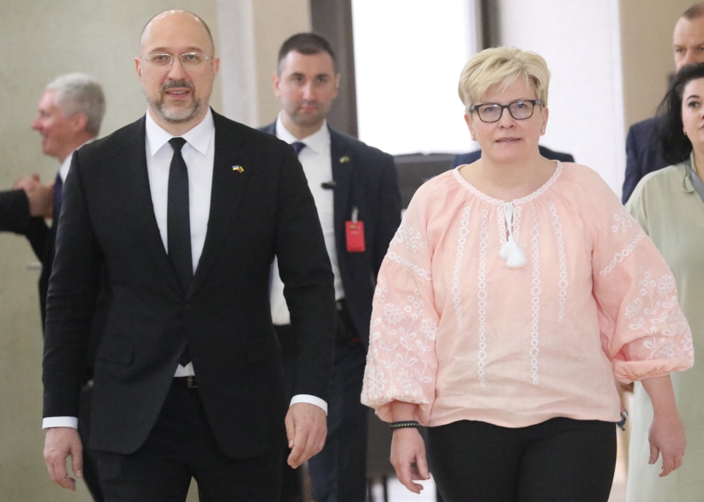 Lithuania's Prime Minister Ingrida Simonyte (R) and Ukraine's Prime Minister Denys Shmyhal arrive to address a joint press conference following a meeting in Vilnius, Lithuania. - AFP

