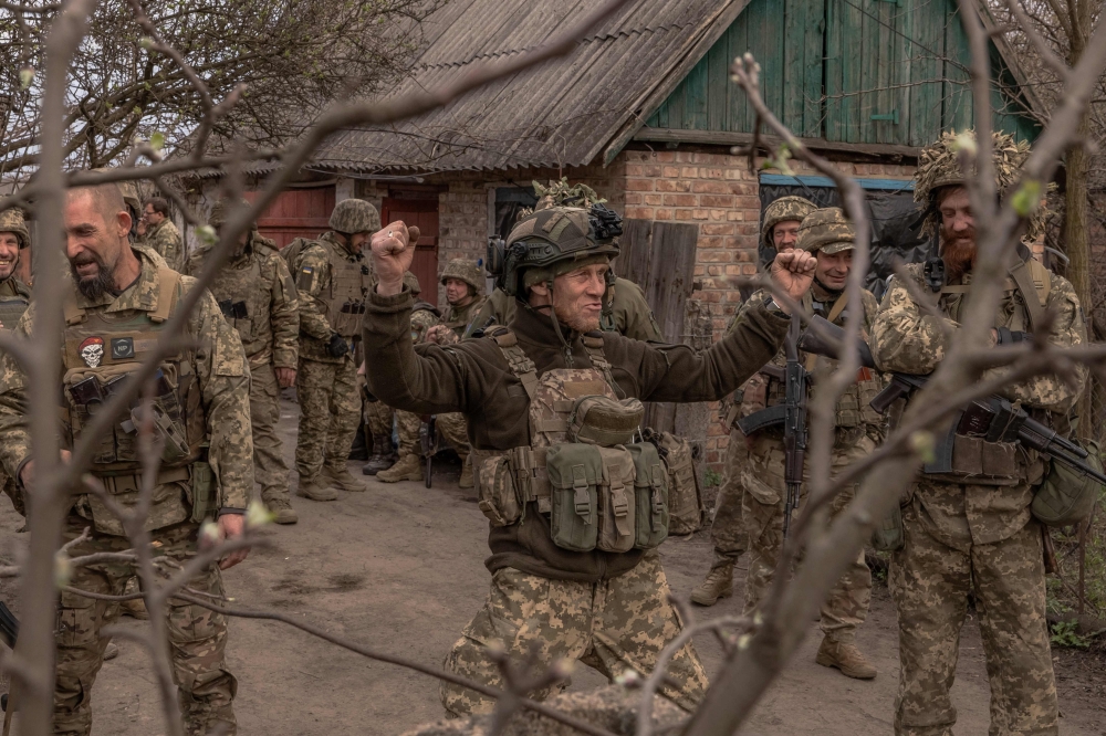 Ukrainian infantry soldiers of the 23rd Mechanized Brigade gather as they wait to head toward the frontline in the Avdiivka direction, in the Donetsk region, amid the Russian invasion of Ukraine. - AFP


