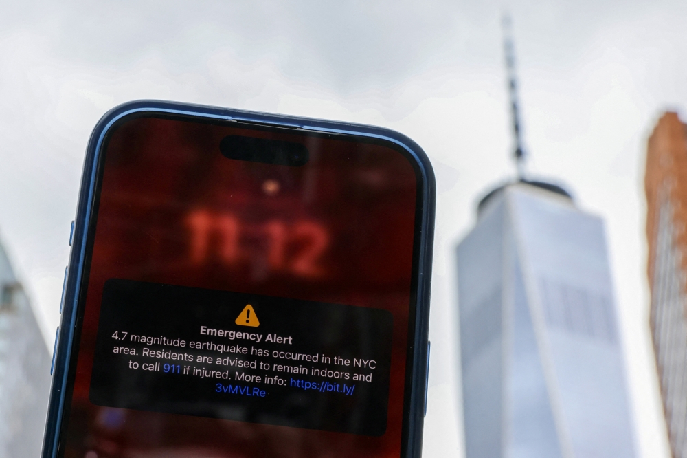 An emergency alert of a magnitude 4.7 earthquake on a cellphone in New York City on Friday. — Reuters