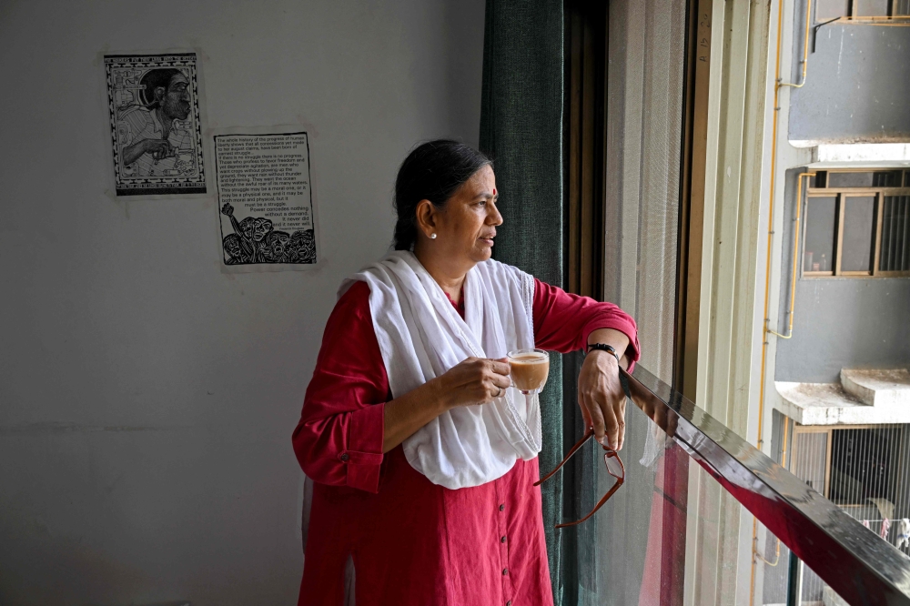 Sudha Bharadwaj drinks tea at her residence in Mumbai.