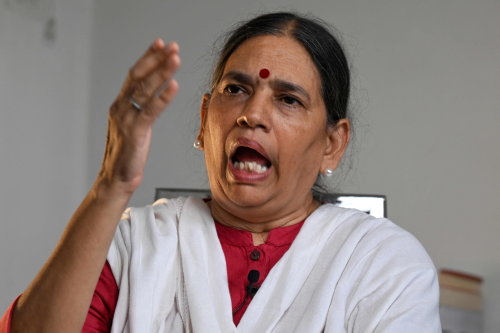 Trade unionist, activist, and lawyer Sudha Bharadwaj gestures as she speaks during an interview 