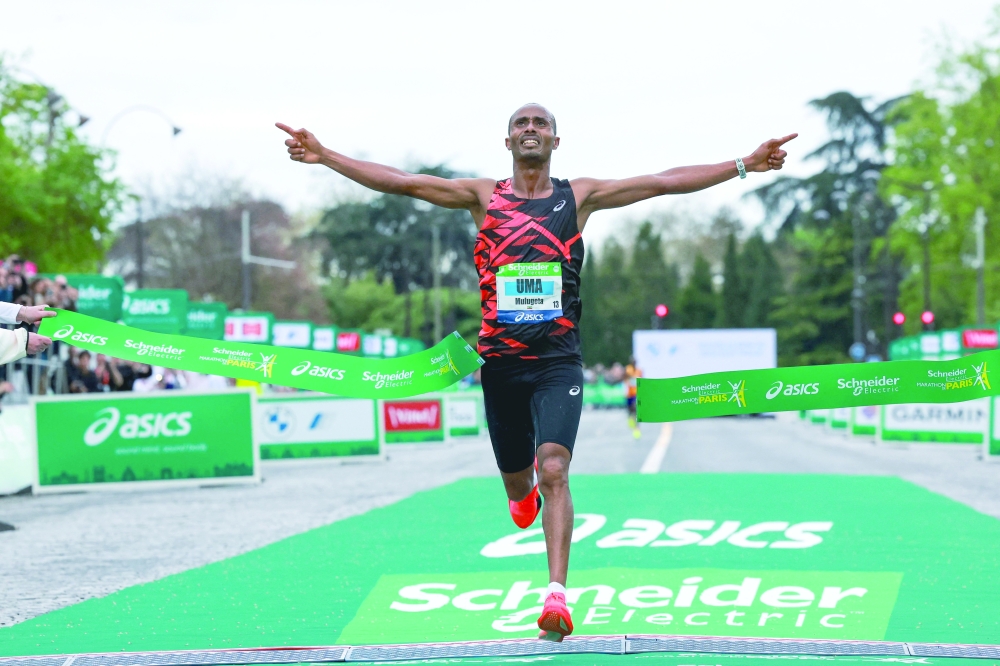 Uma Mulugeta of Ethiopia crosses the finish line.— AFP

