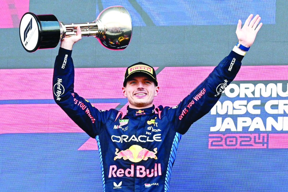 Max Verstappen celebrates on the podium.— AFP

