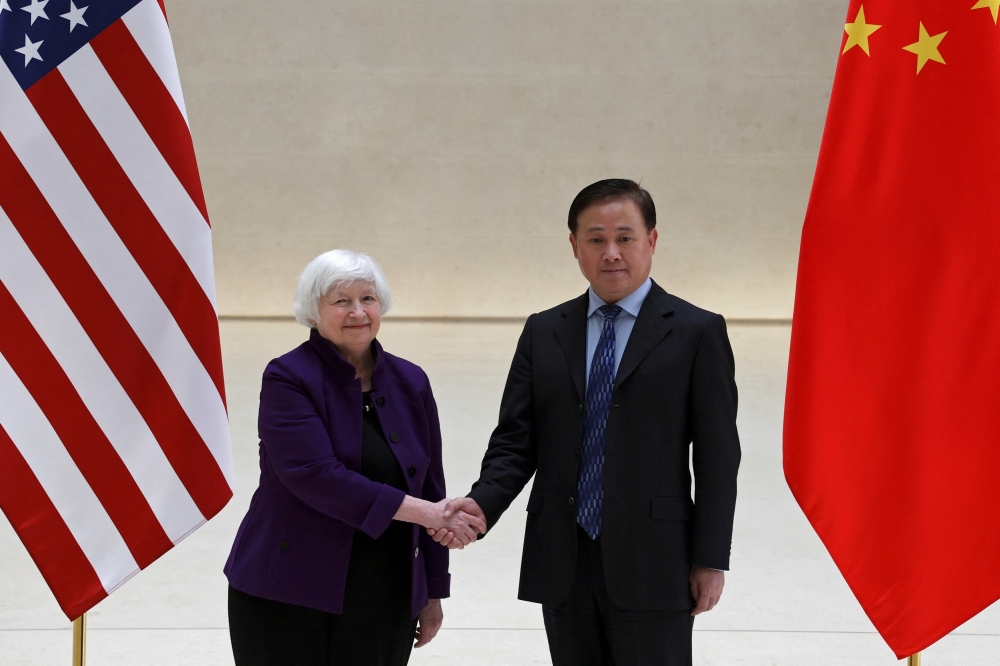 US Treasury Secretary Janet Yellen and People's Bank of China (PBOC) Governor Pan Gongsheng shake hands before a meeting in Beijing. — Reuters