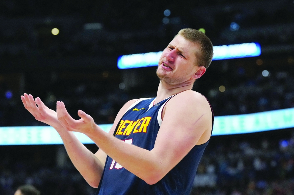 Denver Nuggets center Nikola Jokic (15) reacts in the second half against the Minnesota Timberwolves at Ball Arena. Mandatory Credit: Ron Chenoy-USA TODAY Sports
