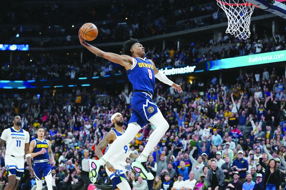 Denver Nuggets' Peyton Watson (8) prepares to dunk ball against the Minnesota Timberwolves at Ball Arena. -- USA Today Sports
