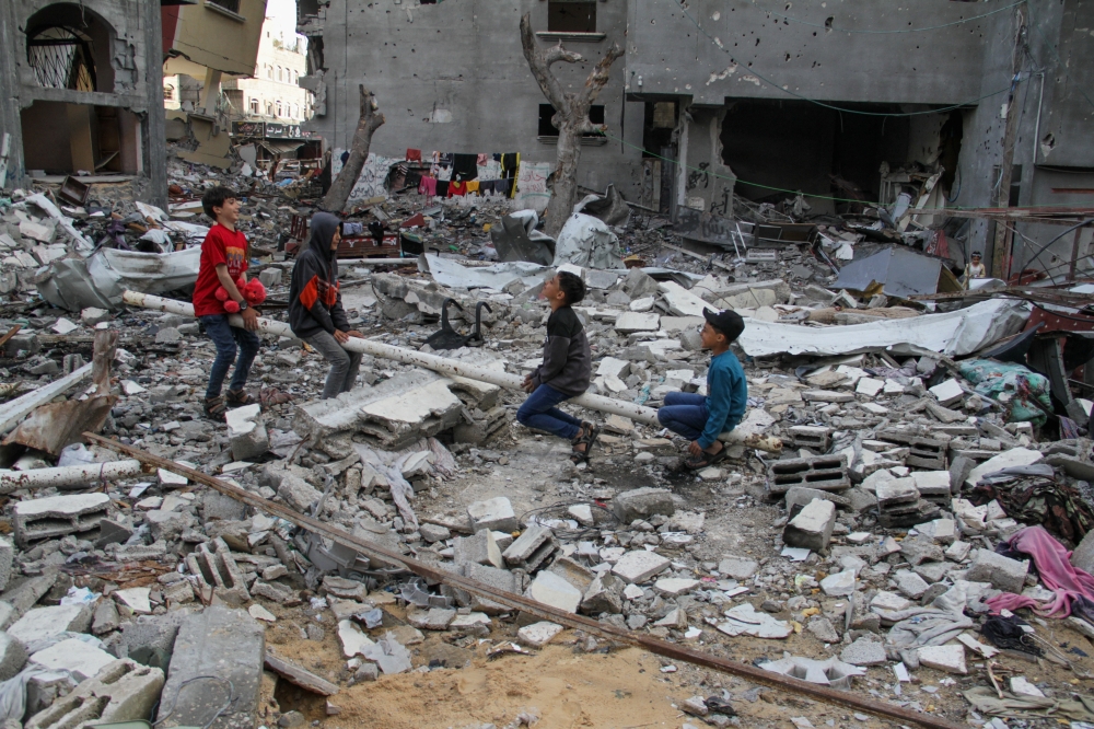 Palestinian children play amid the rubble at a park destroyed during Israel's military offensive, during Eid al-Fitr, amid the ongoing conflict between Israel and the Palestinian Islamist group Hamas, in Gaza City April 11, 2024. REUTERS/Mahmoud Issa