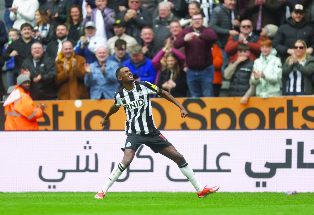 Newcastle United's Alexander Isak celebrates scoring their third goal Action -- Reuters