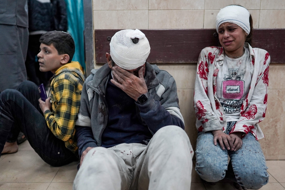 Injured Palestinians injured wait to receive medical treatment at al-Aqsa Martyrs Hospital, Gaza. — AFP 