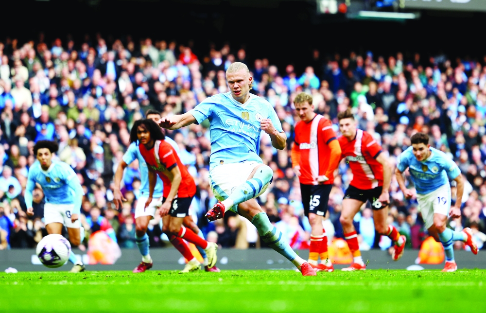 Manchester City's Erling Braut Haaland scores their third goal from the penalty spot -- REUTERS