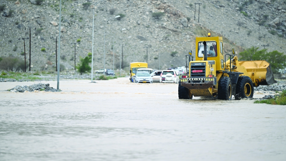 Municipality paving the road and removing the damages