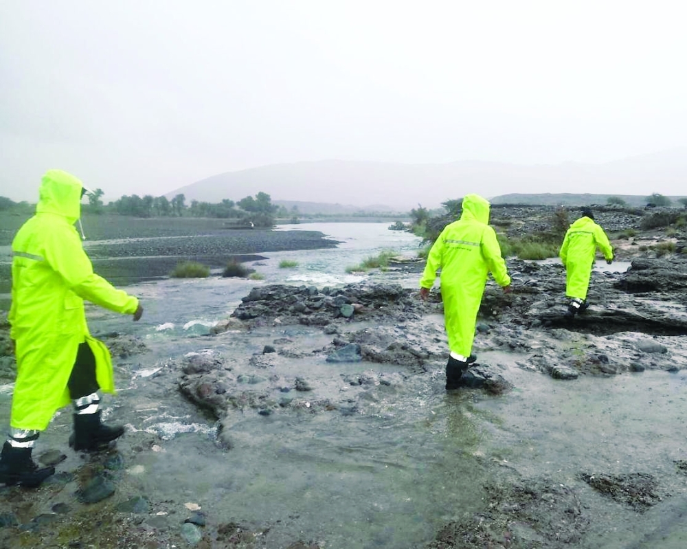 Search and rescue teams carry out search operation for the missing