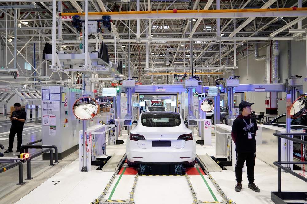 Tesla China-made Model 3 vehicles are seen during a delivery event at its factory in Shanghai. — Reuters