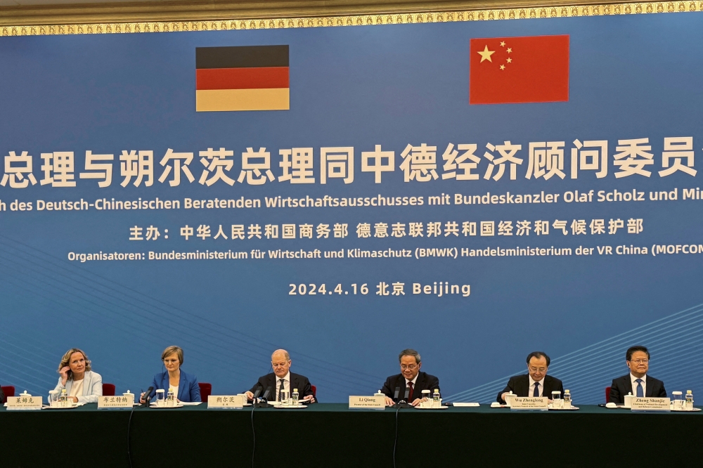 German Chancellor Olaf Scholz and Chinese Premier Li Qiang attend a meeting with Chinese-German Economic Advisory Committee in Beijing. — Reuters 
