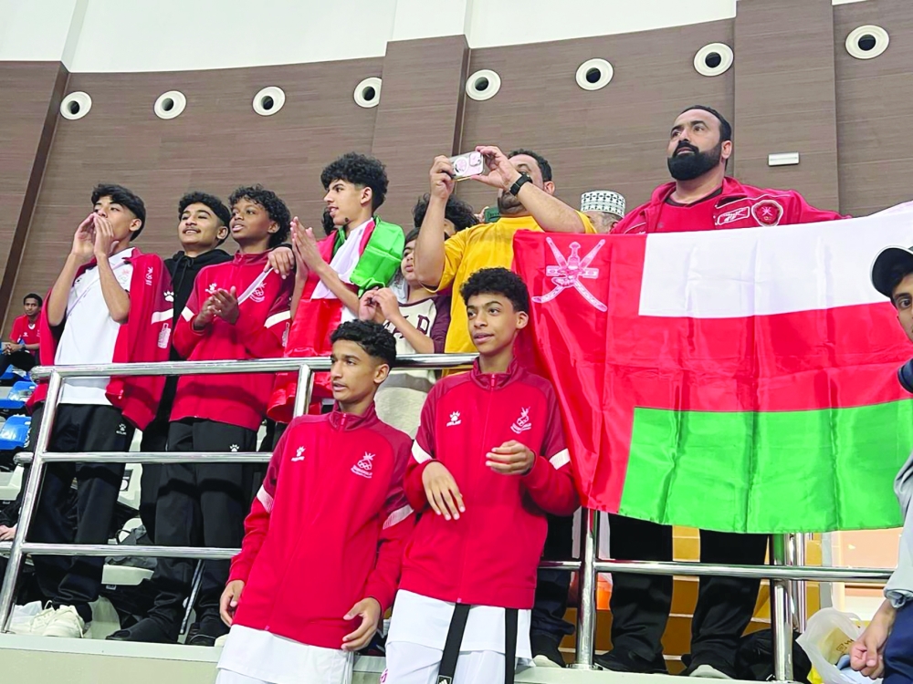 Oman delegation cheers their teammates in Dubai.