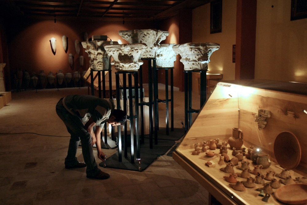 (FILES) Artifacts are on display in the first ever National Museum of Archaeology in Gaza opend recently by Jawdat Khoudary, a Palestinian businessman and collector, on July 28, 2008. Gaza's "Napoleon's Palace" has been destroyed, the ancient Greek site of Anthedon bombed and its only private museum burned down: the war has taken a terrible toll on the rich heritage of the Palestinian territory. But in a strange twist of fate, some of its greatest treasures are safe in a warehouse in Switzerland, ironically all thanks to the blockade that made life in the Gaza Strip such a struggle for the past 16 years. (Photo by MOHAMMED ABED / AFP)

