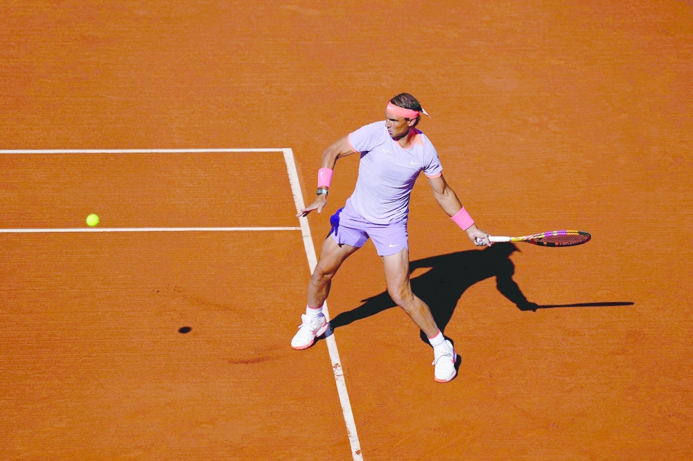 Spain's Rafael Nadal returns the ball to Italy's Flavio Cobolli during the ATP Barcelona Open "Conde de Godo" tennis tournament singles match at the Real Club de Tenis in Barcelona, on April 16, 2024. 