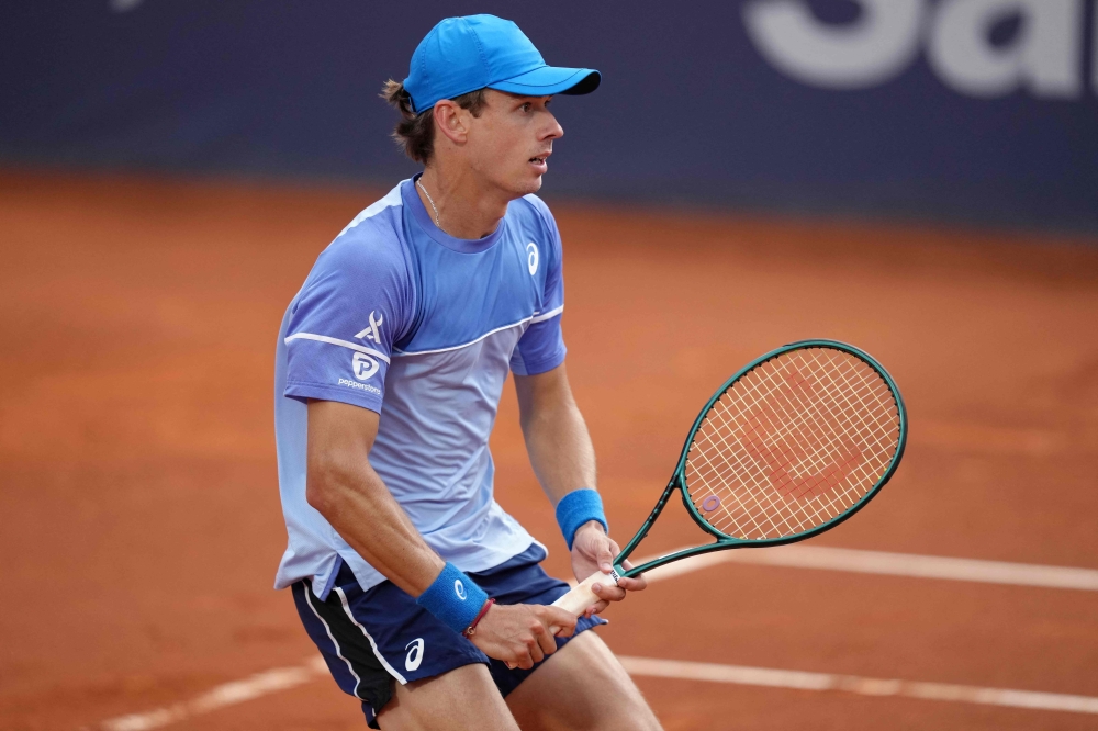 Australia's Alex De Minaur looks on during the ATP Barcelona Open "Conde de Godo" tennis tournament singles match against Spain's Rafael Nadal at the Real Club de Tenis in Barcelona, on April 17, 2024. (Photo by Pau BARRENA / AFP)

