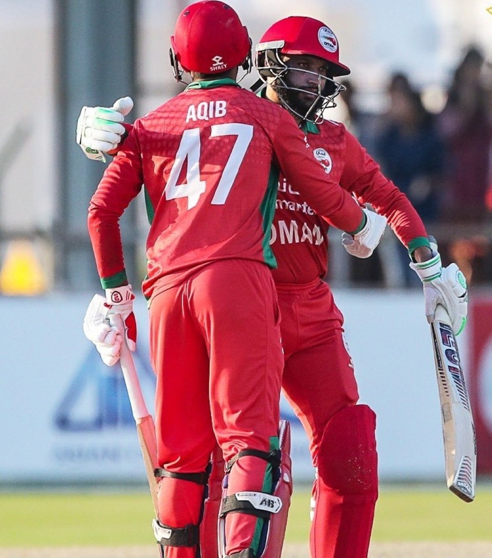 Aqib Ilyas and Khalid Kail celebrate the win over Hong Kong