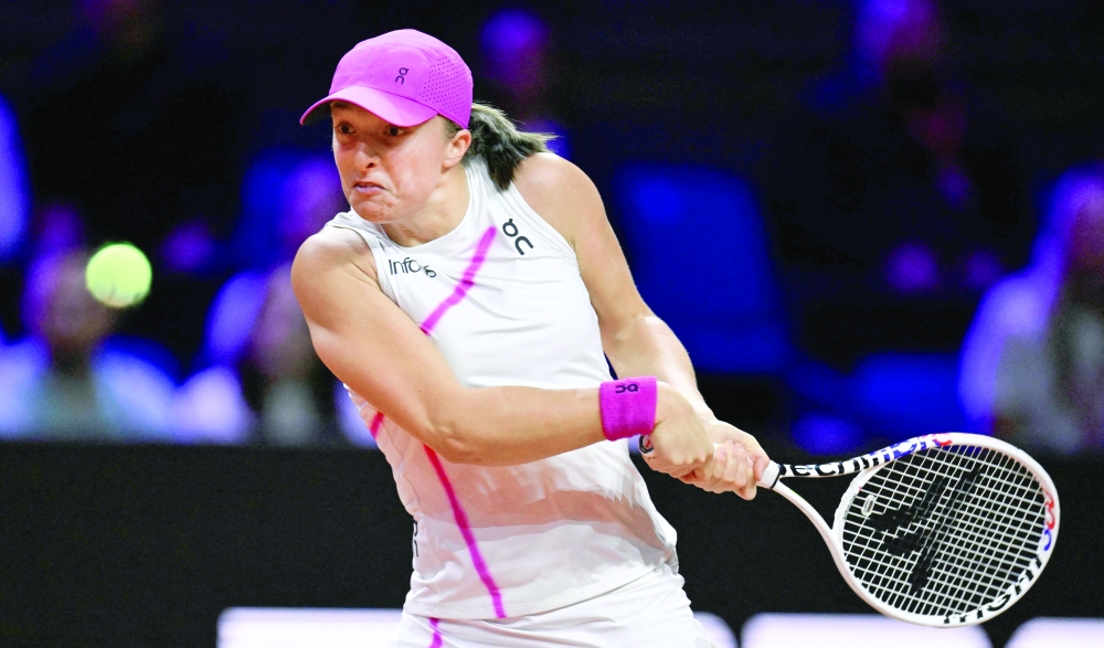 Poland Iga Swiatek returns a ball during the semi-final match at the Women's Tennis Grand Prix WTA tournament -- AFP
