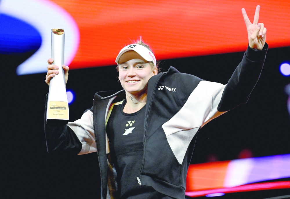 Kazakhstan's Elena Rybakina celebrates with the trophy --REUTERS