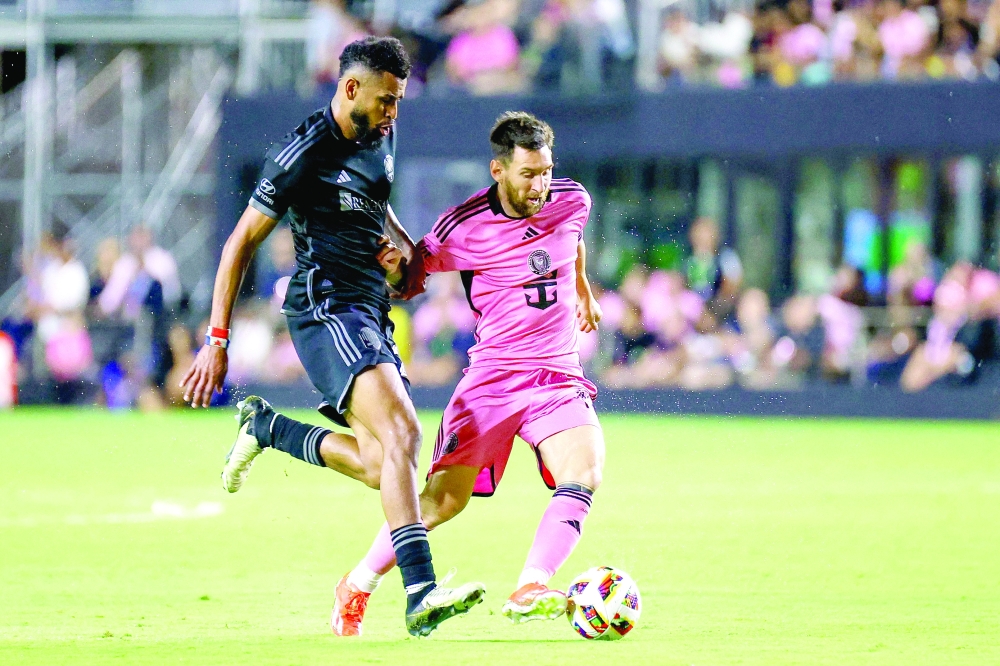 Inter Miami's Argentine forward #10 Lionel Messi (R) fights for the ball  AFP
