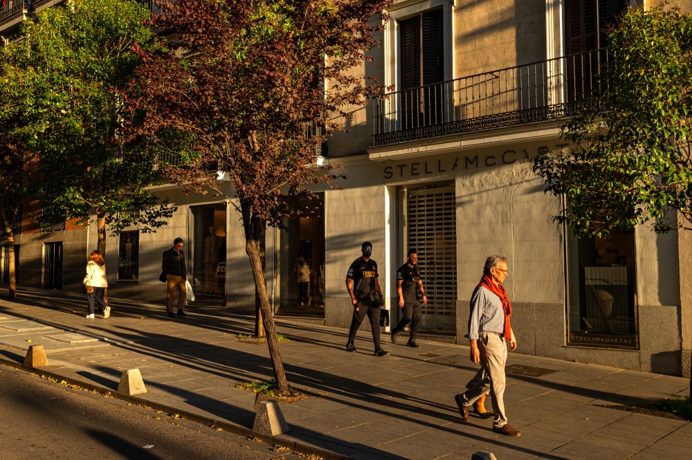 People walking down a main street in the Salamanca neighborhood of Madrid, Spain on April 18, 2024. (Emilio Parra Doiztua/The New York Times)