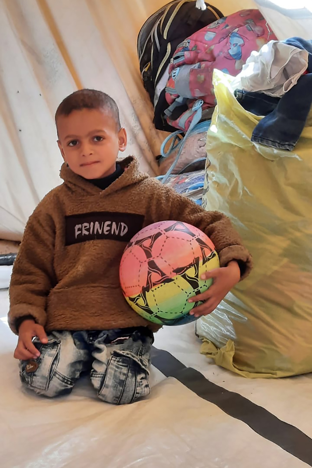 7-year-old son, Mohammed al-Najjar, in the family’s tent in Rafah