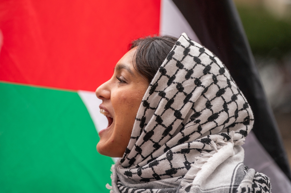 A protester chants slogans in support of Palestinians in Gaza, outside Columbia University in New York City, US, on Wednesday. - Reuters