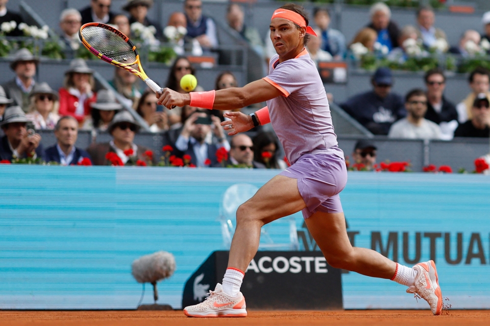 Spain's Rafael Nadal returns the ball to US' Darwin Blanch during the 2024 ATP Tour Madrid Open tennis 