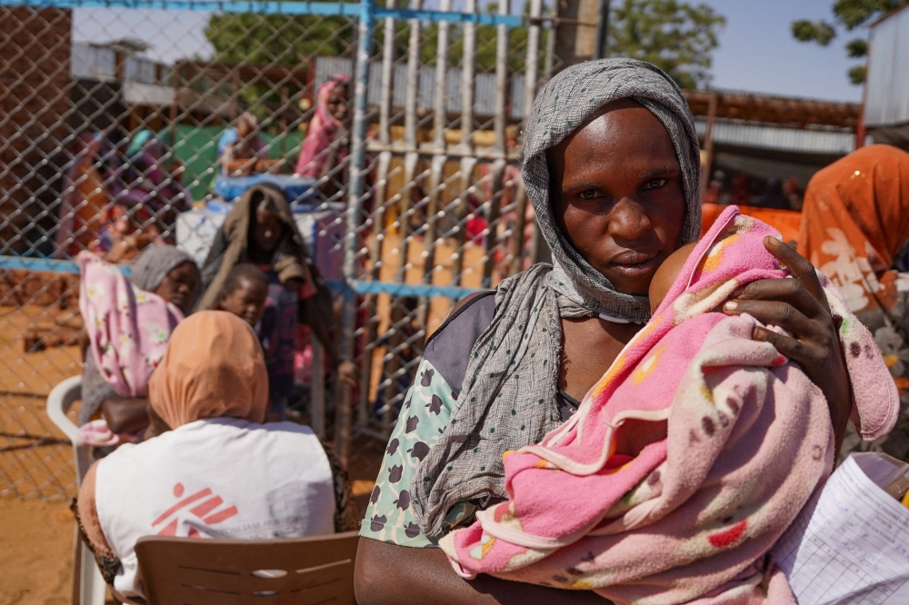 A woman and baby at the Zamzam displacement camp, close to El Fashir in North Darfur
