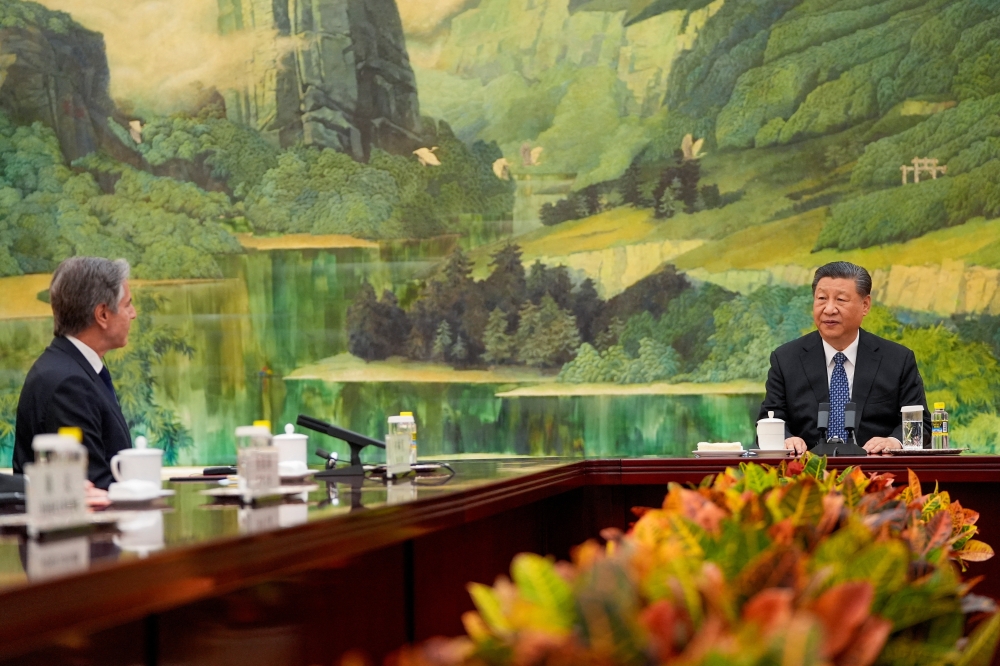Chinese President Xi Jinping talks with U.S. Secretary of State Antony Blinken at the Great Hall of the People