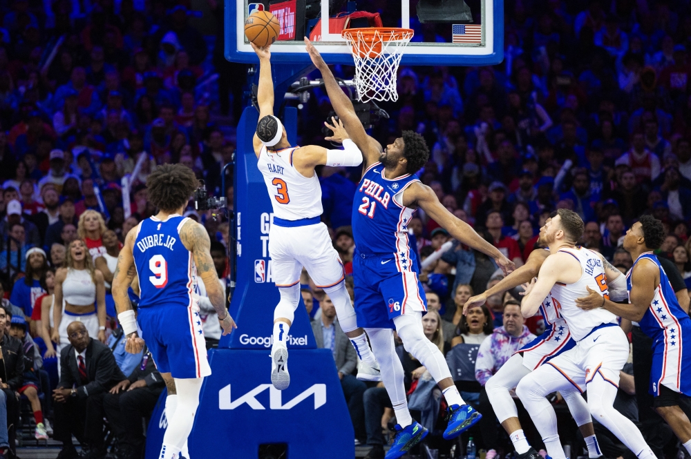 New York Knicks guard Josh Hart (3) drives for a shot against Philadelphia 76ers center Joel Embiid (21) 