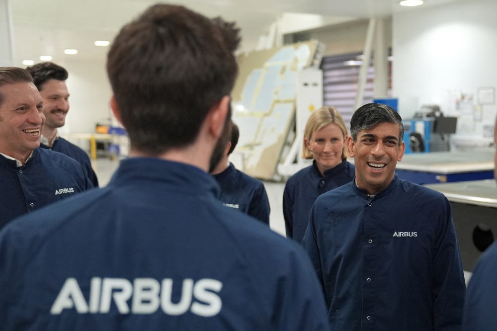 British Prime Minister Rishi Sunak meets with workers as he visits the Airbus factory 