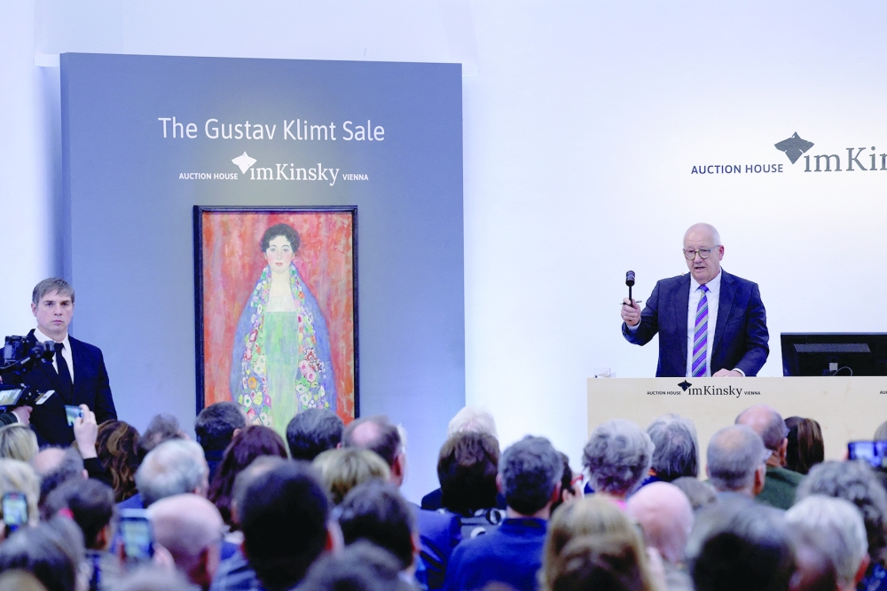 Auctionator Michael Kovacek, co-managing Director of Kinsky Auction House, oversees the bidding during the auction for Austrian artist Gustav Klimt's portrait "Bildnis Fraeulein Lieser," last seen in public in 1925, in Vienna, Austria, April 24, 2024. 