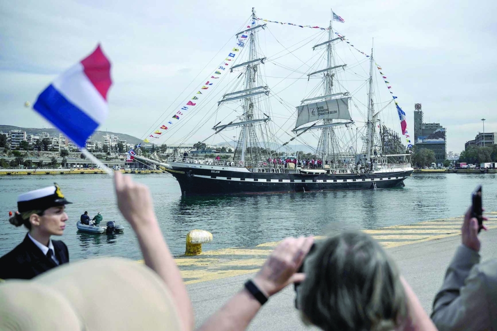 French 19th-century three-masted barque Belem sets sails from the Piraeus port, near Athens, with the Olympic flame on board to begin its journey to France on April 27, 2024, a day after Greece handed over the torch of the 2024 Games to Paris organisers. AFP