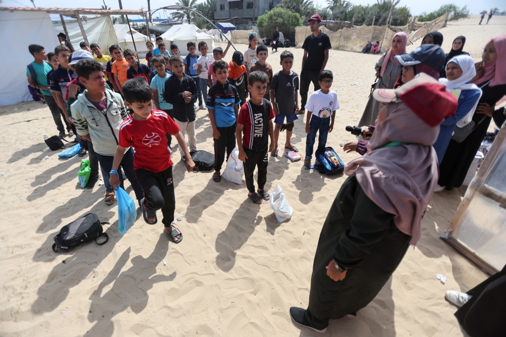 Palestinian students gather in tents as schools remain closed due to Israel's military offensive, in Khan Younis. — Reuters 